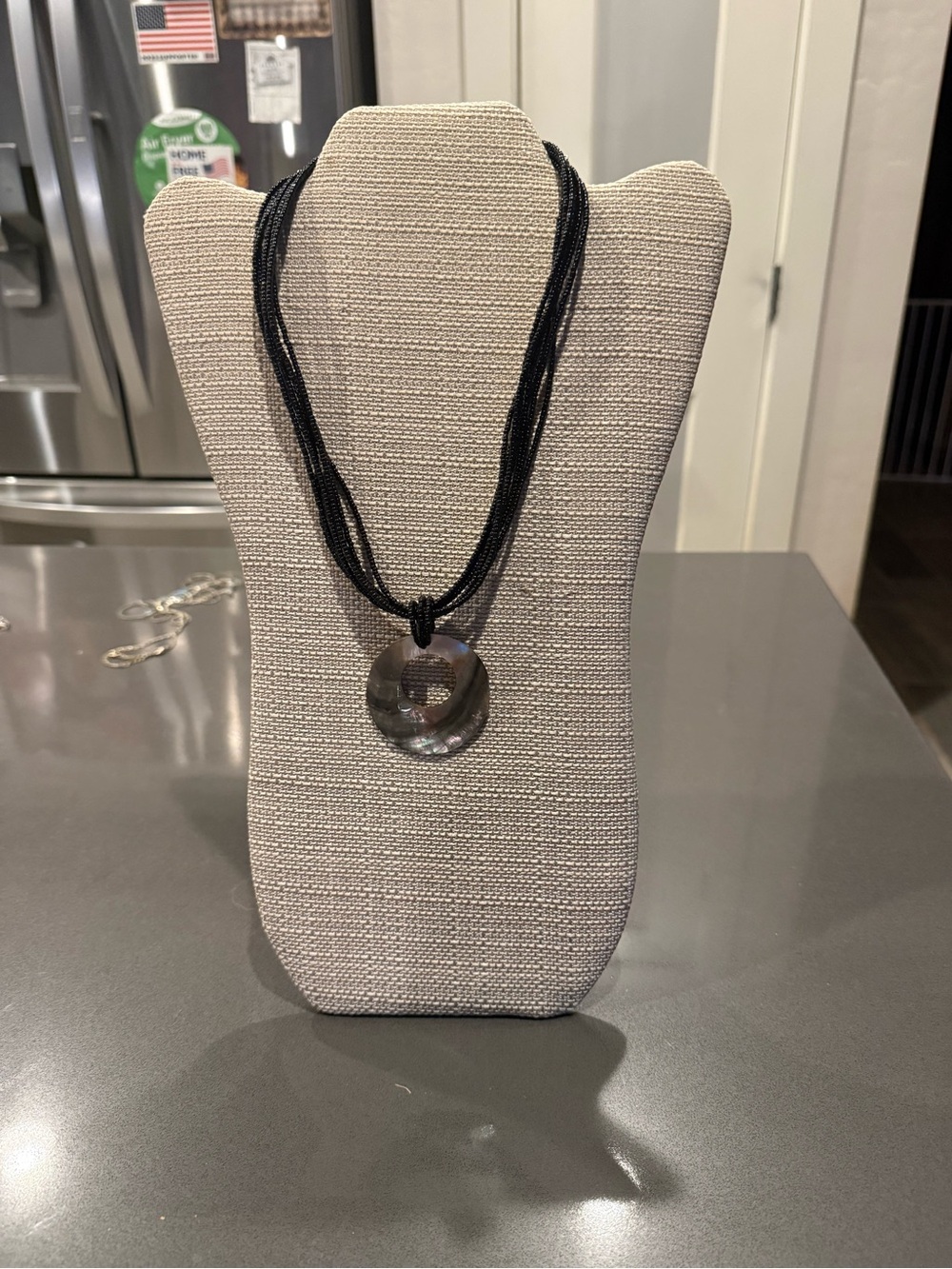 Black Multi-Strand Necklace with Iridescent Donut Pendant